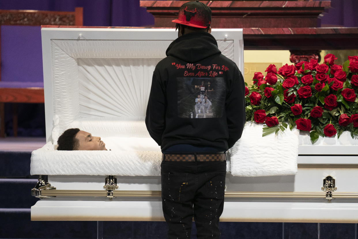 Mourners gather to pay respects to Daunte Wright during his wake at Shiloh Temple International Ministries, Wednesday, April 21, 2021, in Minneapolis. The 20-year-old Wright was killed by then-Brooklyn Center police officer Kim Potter during a traffic stop. (AP Photo/John Minchillo)