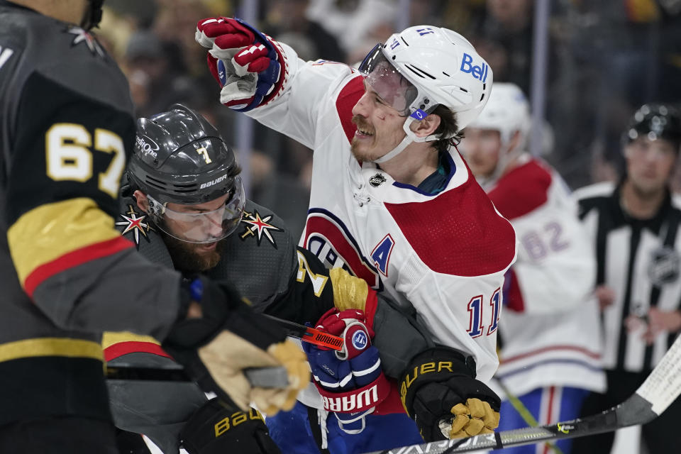 Vegas Golden Knights defenseman Alex Pietrangelo (7) and Montreal Canadiens right wing Brendan Gallagher (11) tussle during the first period in Game 5 of an NHL hockey Stanley Cup semifinal playoff series Tuesday, June 22, 2021, in Las Vegas. (AP Photo/John Locher)