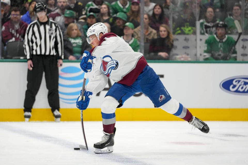 Colorado Avalanche defenseman Cale Makar shoots against the Dallas Stars during the first period of an NHL hockey game, Thursday, Jan. 4, 2024 in Dallas. (AP Photo/Julio Cortez)