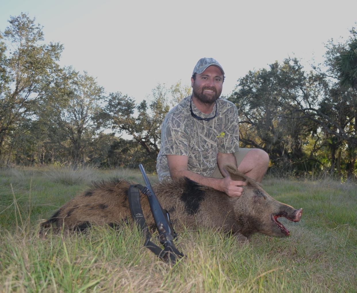 Ian Nance poses with a wild hog.