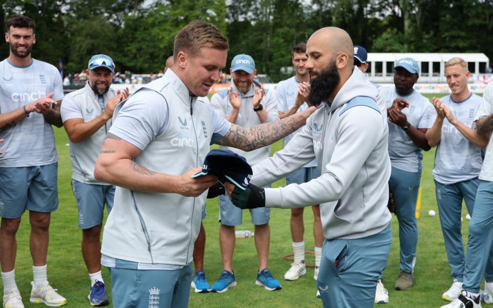 Moeen Ali presents Jason Roy of England with his 100th cap  - Getty