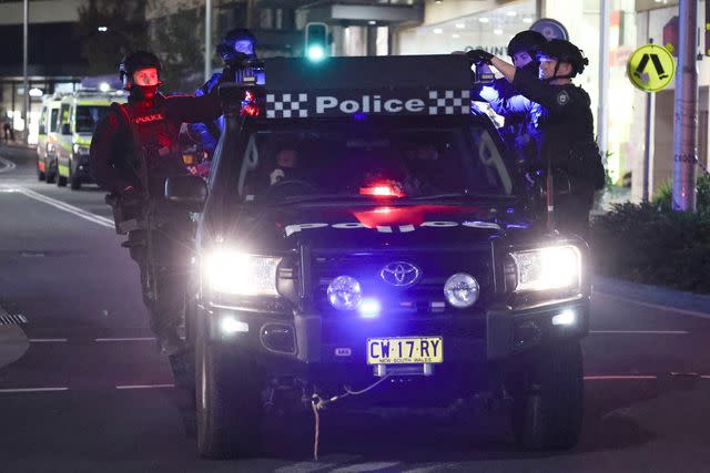 <p>DAVID GRAY/AFP via Getty</p> Police vehicle responds to the scene at the Westfield Bondi Junction shopping mall in Sydney on April 13