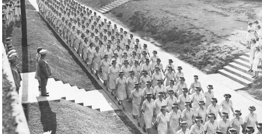 Women Marines marching together as a unit at the Henderson Hall Marine Base in Arlington, Va., circa 1944.