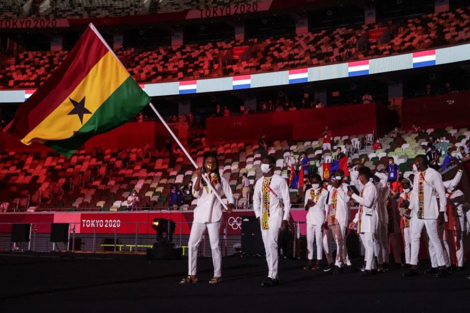 Ghana's flag bearer Nadia Eke leads the delegation during the Tokyo 2020 Olympic Games opening ceremony's parade of athletes, at the Olympic Stadium in Tokyo on July 23, 2021.<span class="copyright">Hannah McKay—AFP via Getty Images</span>