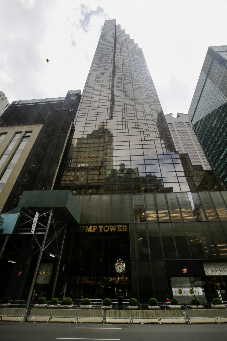 FILE - In this Tuesday, July 7, 2020 file photo, pedestrians walk past the Trump Tower building in New York. Trump’s true financial picture has gotten renewed scrutiny in the wake of a New York Times report in September 2020 that he declared hundreds of millions in losses in recent years, allowing him to pay just $750 in taxes the year he won the presidency, and nothing for 10 of 15 years before that. (AP Photo/Frank Franklin II, File)