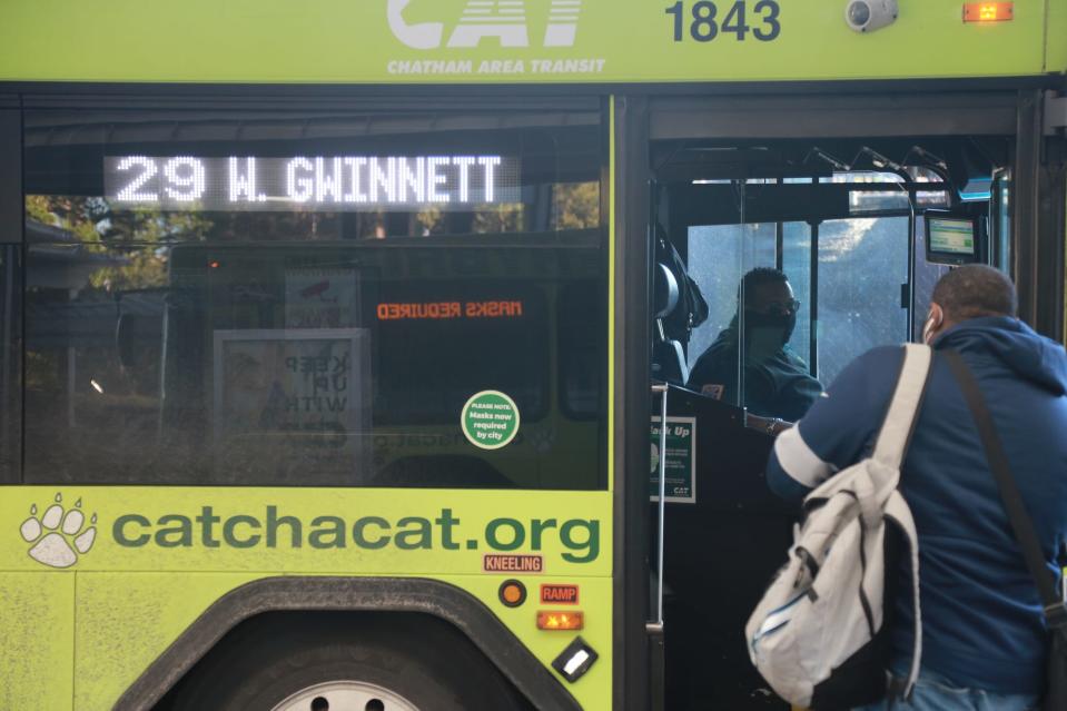 A driver talks with a passenger at the Chatham Area Transit Joe Murray Rivers, Jr. Intermodal Transit Center.