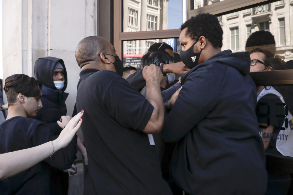 People push to enter the Niketown shop in London on Monday.