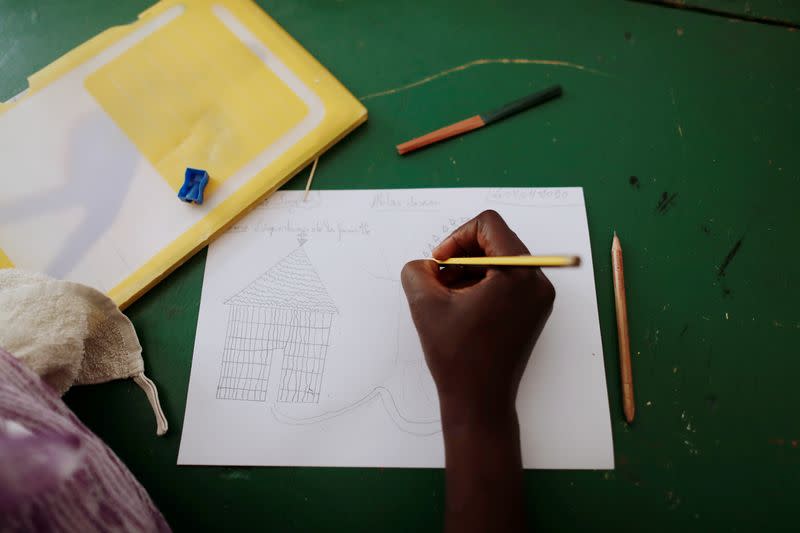 Woman who said she was raped twice, attends a drawing workshop at La Maison Rose in Dakar