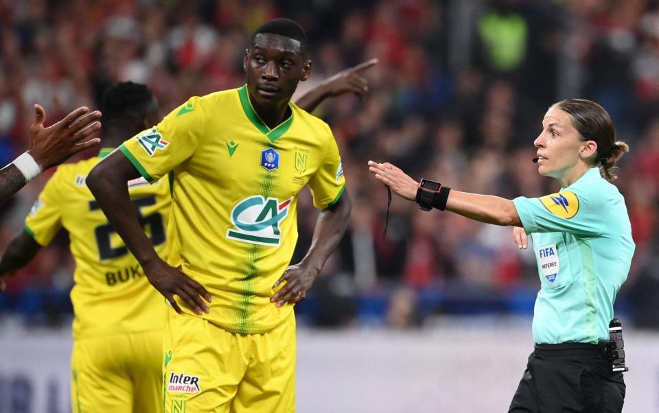 French Referee Stephanie Frappart (R) gestures to Nantes' Malian defender Molla Wague (L) during the French Cup final football match between OGC Nice and FC Nantes at the Stade de France, in Saint-Denis, on the outskirts of Paris, on May 7, 2022. - GETTY IMAGES