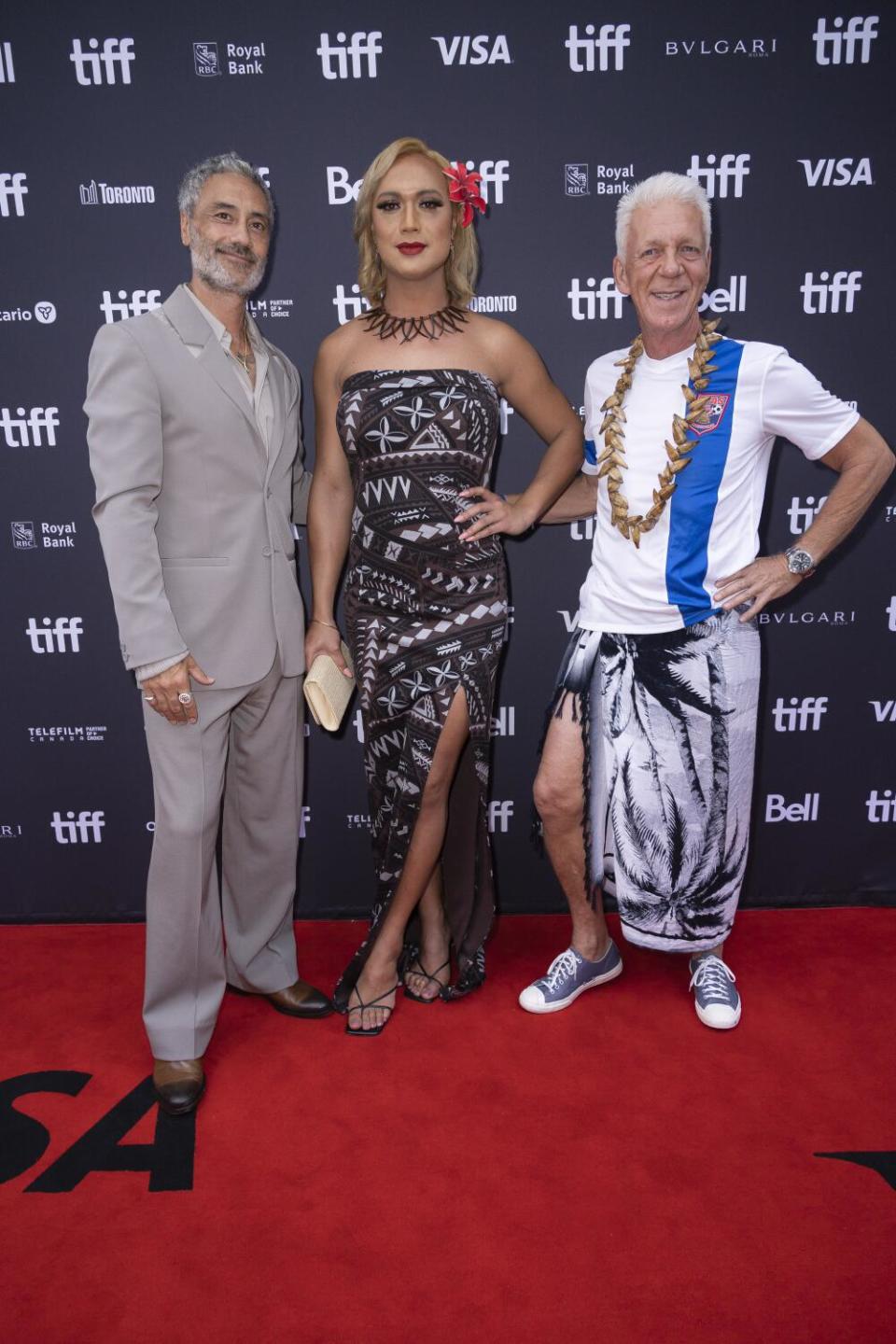 Director Taika Waititi; Jaiyah Saelua, the first transgender international footballer; and Thomas Rongen pose for media.