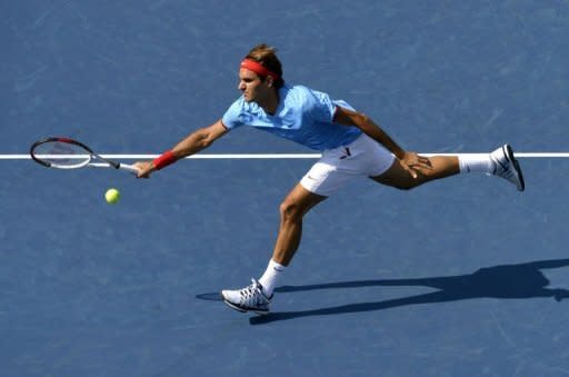 World number one Roger Federer, pictured on September 1, made the US Open quarter-finals without hitting a ball when American opponent Mardy Fish withdrew due to "health reasons", a tournament spokesman said