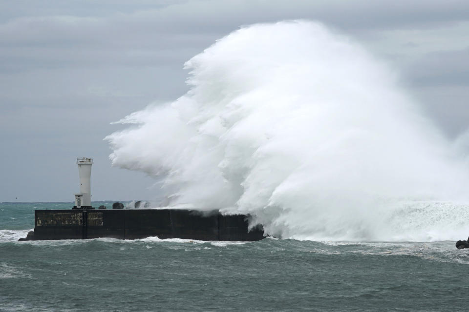Surging waves hit against the breakwater while Typhoon Hagibis approaches at a port in town of Kiho, Mie prefecture, central Japan Friday, Oct. 11, 2019. A powerful typhoon is advancing toward the Tokyo area, where torrential rains are expected this weekend. (AP Photo/Toru Hanai)