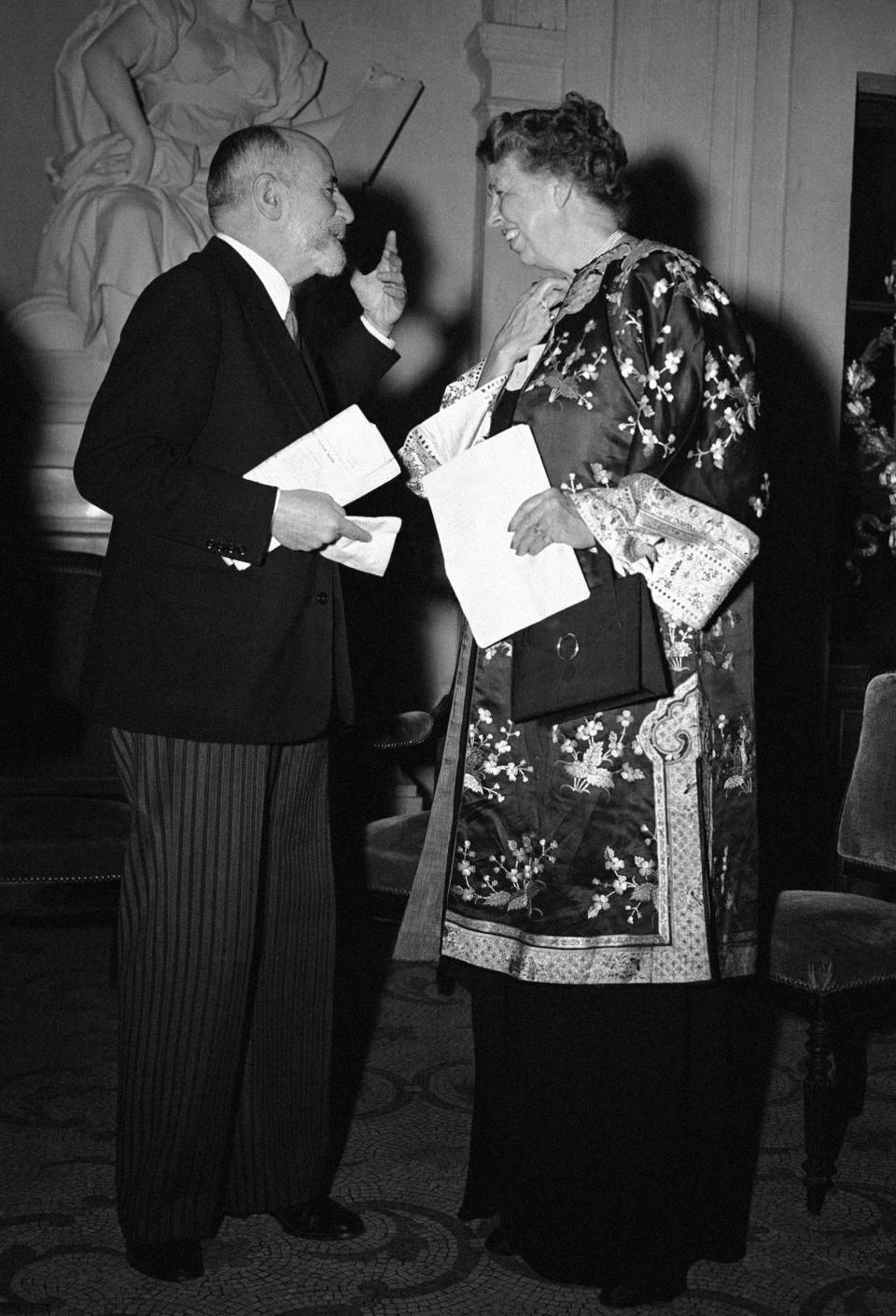 FILE - Eleanor Roosevelt talks with Rene Cassin, French member of the United Nations Commission on human rights, before Mrs. Roosevelt's speech at the Sorbonne in Paris, Sept. 28, 1948. Seventy-five years ago on Sunday Dec. 10, 2023, the U.N. General Assembly approved the Universal Declaration of Human Rights at a meeting in Paris. It laid one of the foundation stones of the international order that emerged following the horrors of World War II. (AP Photo/File)