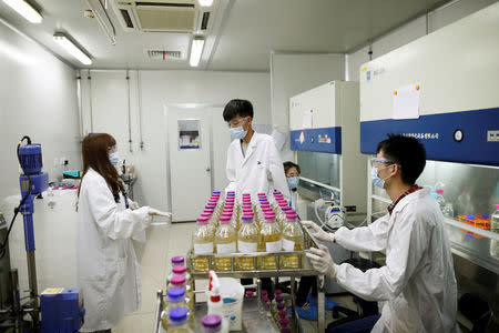 Researchers work at a laboratory of WuXi AppTec (Shanghai) Co., Ltd. in Shanghai, China, April 25, 2016. REUTERS/Aly Song