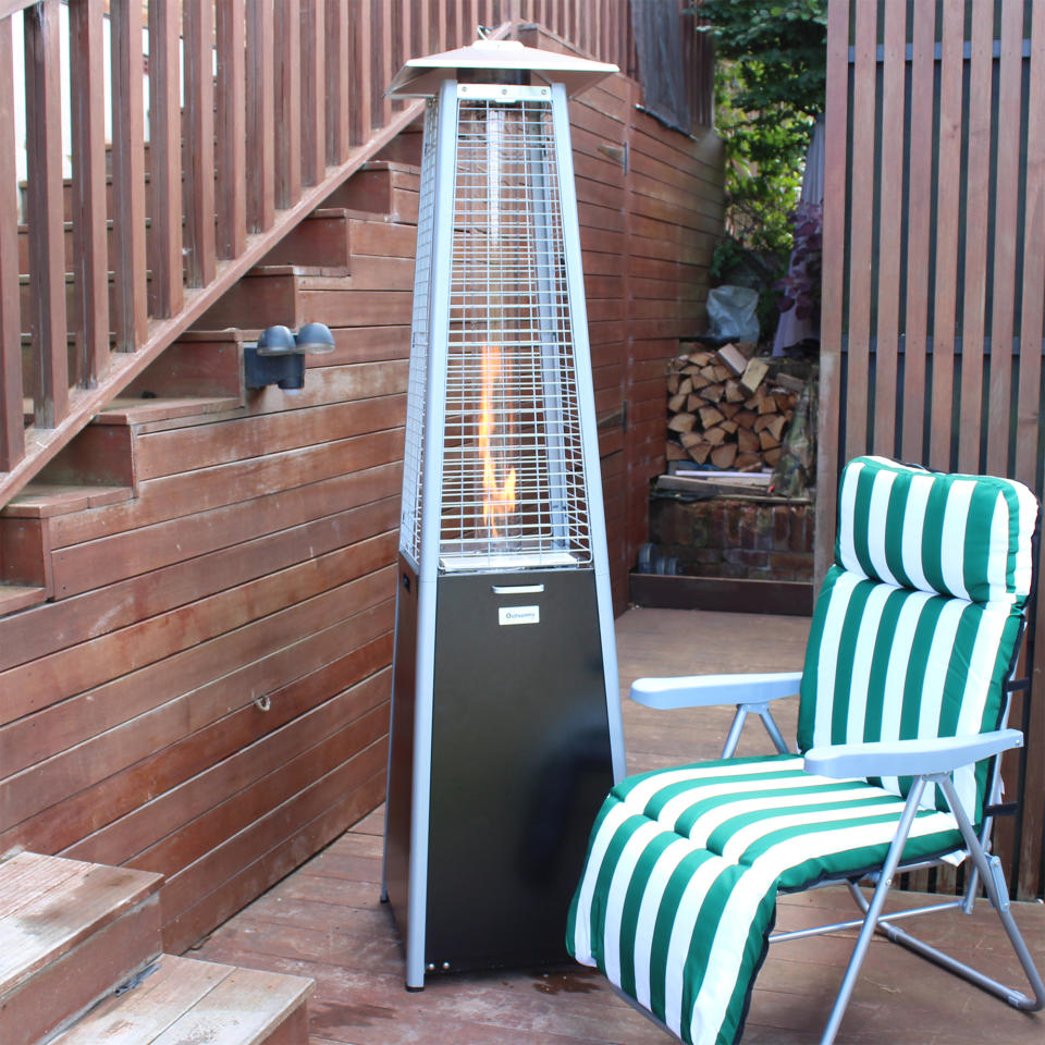 The Outsunny 11.2kw Pyramid Gas Patio Heater being unboxed and tested on a wooden deck