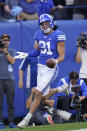 BYU linebacker Max Tooley (31) celebrates his touchdown on an interception return against Utah State during the first half of an NCAA college football game Thursday, Sept. 29, 2022, in Provo, Utah. (AP Photo/Rick Bowmer)