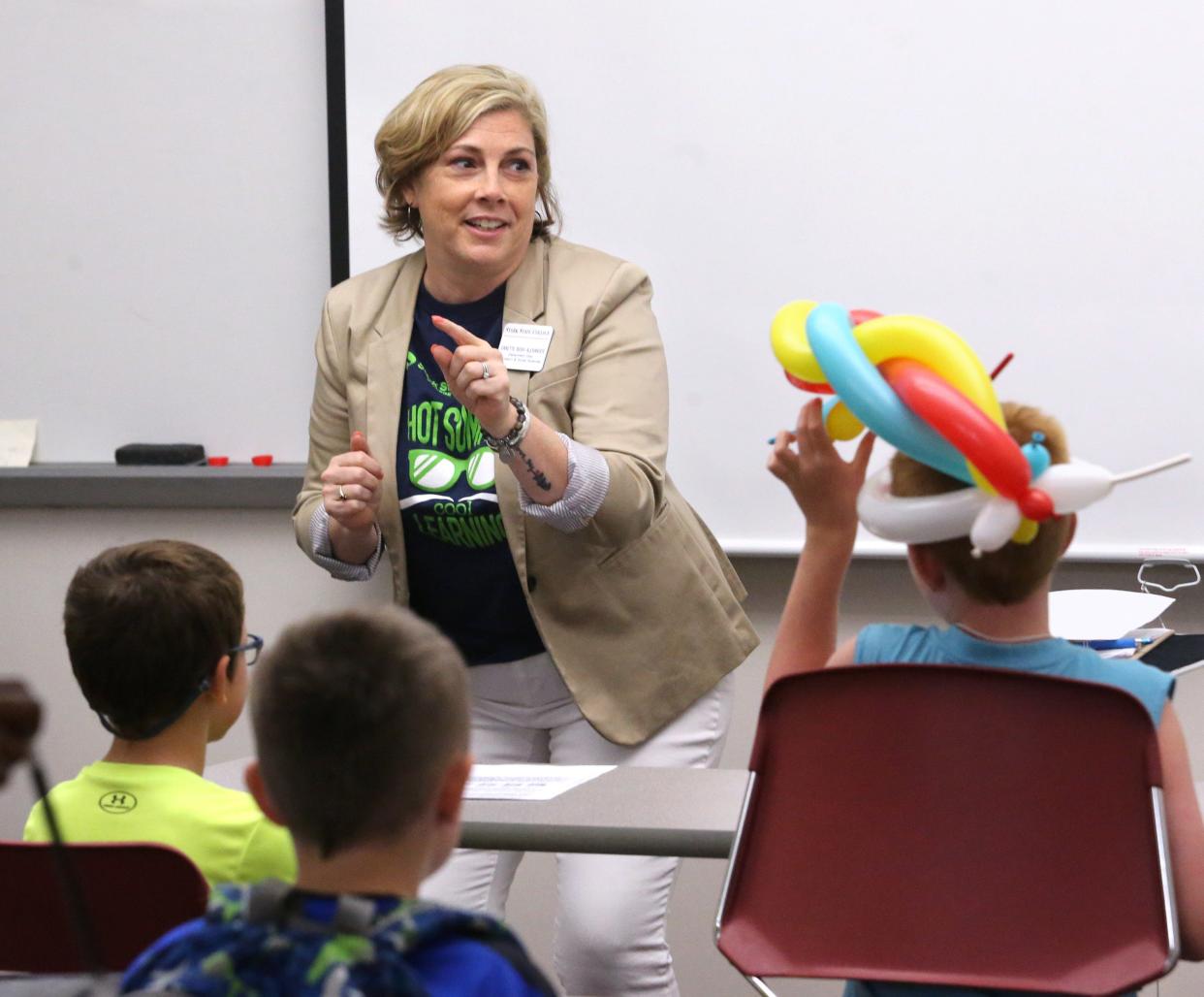 Danette Bosh Alexander leads a class called, "Magic! Magic! Magic!" during Kids' College at Stark State College in Jackson Township. She is the chair of Education and Social Sciences Department, an associate professor of education and the director of the Kids' College.