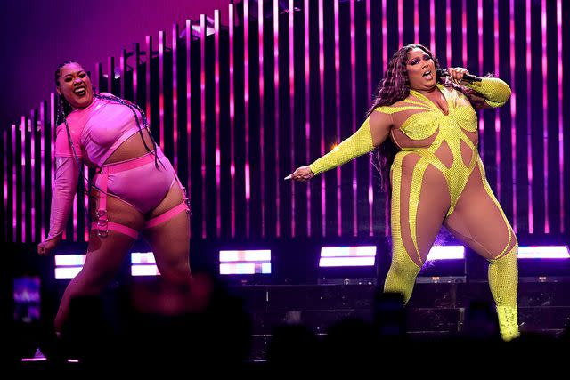 <p>Jamie McCarthy/Getty Images</p> Lizzo performs onstage at Madison Square Garden in October 2022