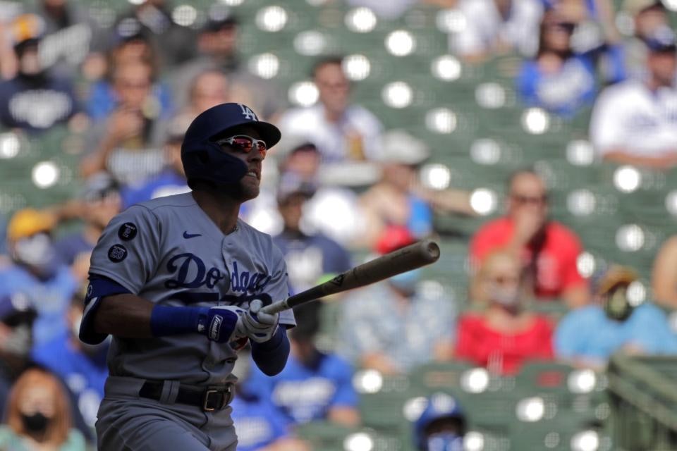 Matt Beaty watches his grand slam during the second inning of Sunday's game.