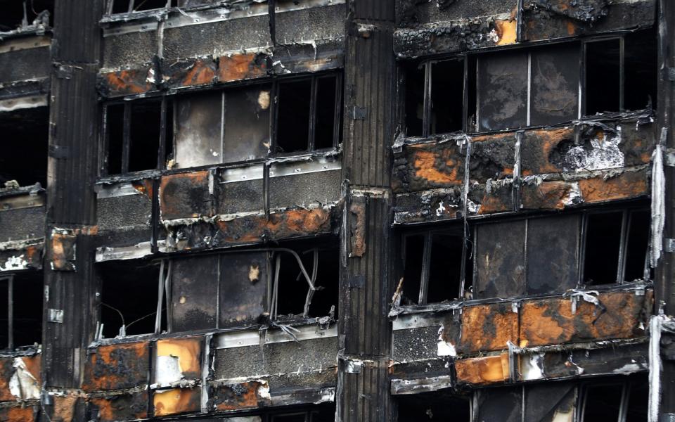 Damage to Grenfell Tower is seen following the catastrophic fire, in north Kensington, London - Credit: REUTERS/Peter Nicholls