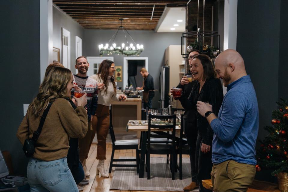 Becca Timms welcomes guests to The Community Table with a custom cocktail and light conversation to start the evening.