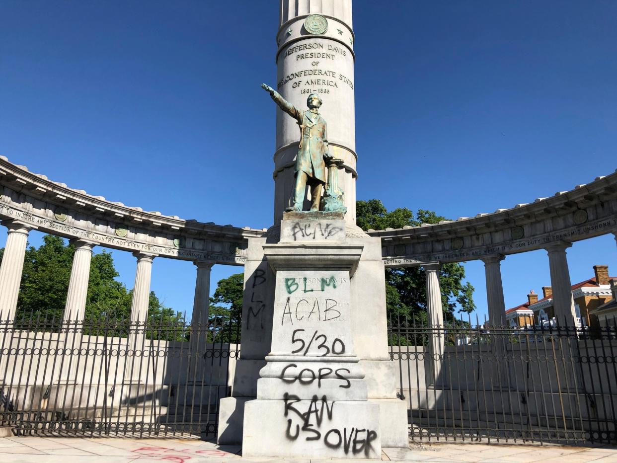 A monument to Confederate President Jefferson Davis in Richmond, Virginia is covered with graffiti: AP