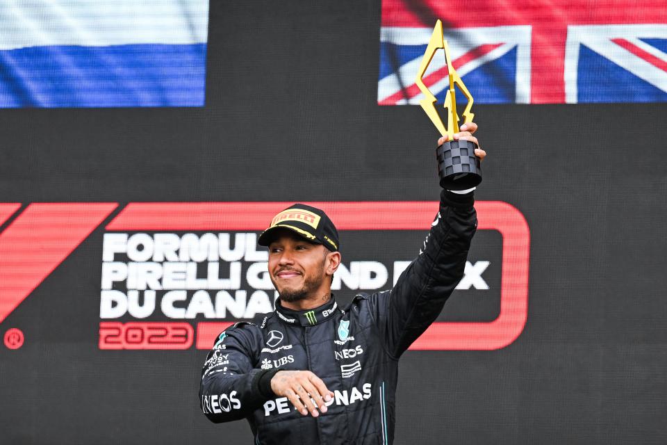 Formula 1 driver Lewis Hamilton salutes the crowd after his third-place finish at the Canadian Grand Prix on June 18, 2023.