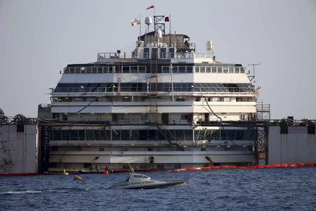 The cruise liner Costa Concordia is seen during a refloat operation at Giglio harbour at Giglio Island July 14, 2014. REUTERS/Alessandro Bianchi