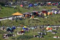 Iranians spend time outdoors observing the ancient festival of Sizdeh Bedar, an annual public picnic day on the 13th day of the Iranian new year, in Tehran, Iran, Wednesday, April 2, 2014. Sizdeh Bedar, which comes from the Farsi words for “thirteen” and “day out,” is a legacy from Iran’s pre-Islamic past that hard-liners in the Islamic Republic never managed to erase from calendars. Many say it’s bad luck to stay indoors for the holiday. (AP Photo/Ebrahim Noroozi)