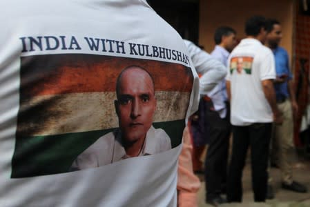 People wait before the issue of a verdict in the case of Indian national Kulbhushan Jadhav by International Court of Justice, in Mumbai