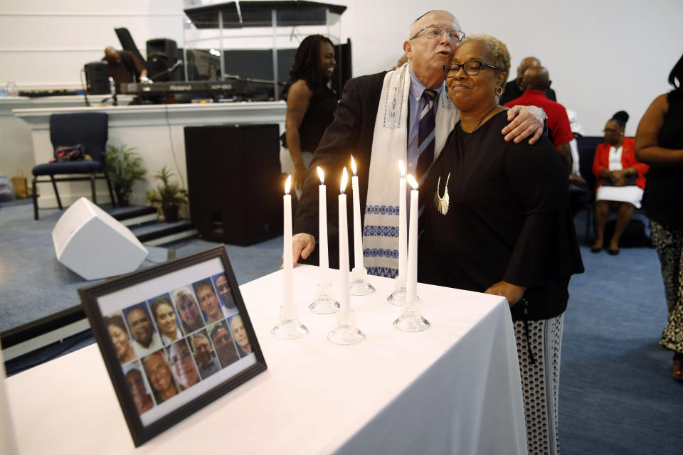 Rabbi Israel Zoberman, left, embraces churchgoer Pamela Johnson after a vigil at Piney Grove Baptist Church, June 2, 2019, in response to a mass shooting at a municipal building in Virginia Beach, Va. (Photo: Patrick Semansky/AP)