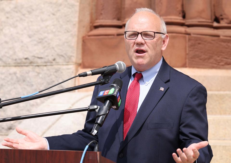 Plymouth County District Attorney Timothy Cruz addresses the crowd as Brockton celebrates the Day of Portugal at City Hall Plaza on Friday, June 10, 2022. Cruz speaks about his grandfather who moved to Brockton from Portugal and his family name was 'daCruz.'