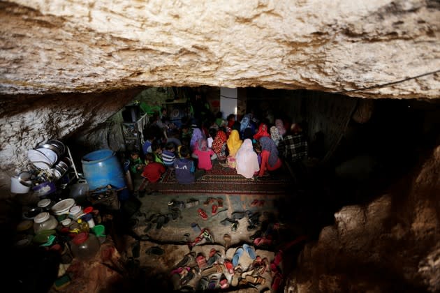 Children displaced by the Syrian civil war attend school inside a cave on March 27, 2016. <a href="http://www.theatlantic.com/photo/2016/10/scenes-from-underground/505610/?utm_source=yahoo" rel="nofollow noopener" target="_blank" data-ylk="slk:See more scenes from underground here;elm:context_link;itc:0;sec:content-canvas" class="link ">See more scenes from underground here</a>. (Khalil Ashawi / Reuters)