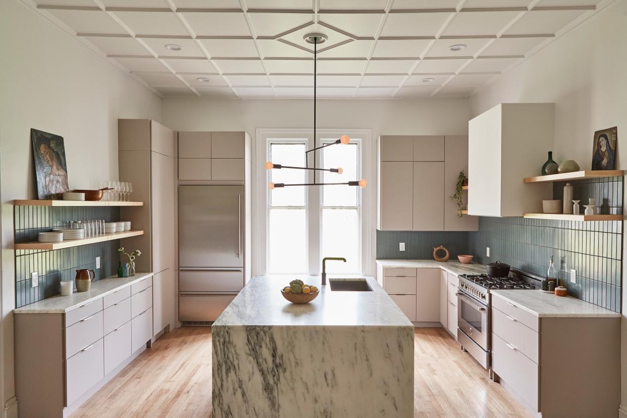 Nick and Michael moved the kitchen from its antiquated position in the back of the house to a prime central location so the room can rightfully serve as the heart of the home.