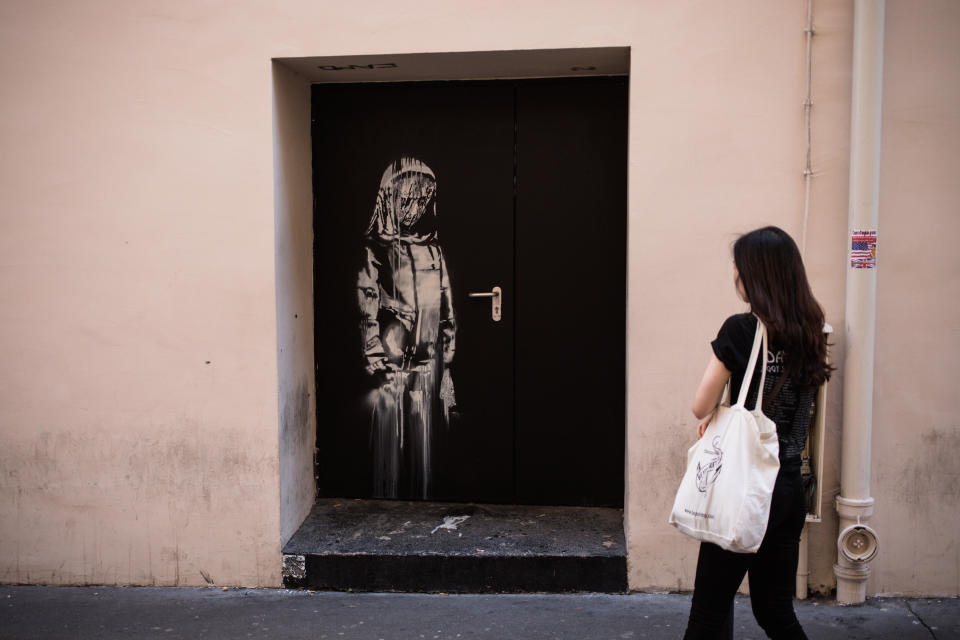 PARIS, FRANCE - JUNE 26: A recent artwork by street artist Banksy on a side street to the Bataclan concert hall where a terrorist attack killed 90 people on Novembre 13, 2015, on June 26, 2018 in Paris, France. The mysterious British street artist has created a series of new murals in Paris in the last few days. (Photo by Aurelien Morissard/IP3/Getty Images)