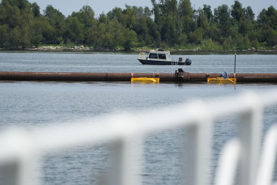 Work in the Mississippi River is seen where sills are being made to help limit salt water intrusion that is progressing upriver due to the unusually low water level in the river in Plaquemines Parish, La., Monday, Sept. 25, 2023. (AP Photo/Gerald Herbert)