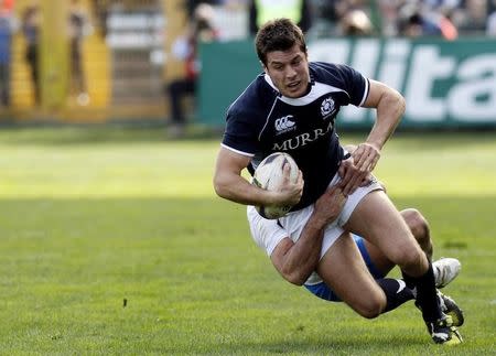 Italy's Craig Gower (rear) tackles Hugo Southwell of Scotland during their Six Nations rugby union match at the Flaminio Stadium in Rome February 27, 2010. REUTERS/Giampiero Sposito