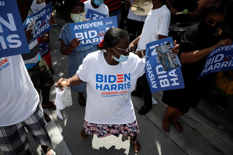 Supporters of Democratic U.S. presidential nominee Joe Biden attend a gathering as he campaigns in Miami