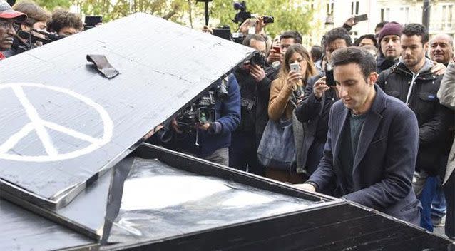 Emotional scenes from outside the Bataclan today. Source: Supplied.