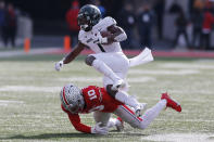 Michigan State receiver Jayden Reed, top, tries to jump over Ohio State defensive back Cameron Martinez during the first half of an NCAA college football game Saturday, Nov. 20, 2021, in Columbus, Ohio. (AP Photo/Jay LaPrete)