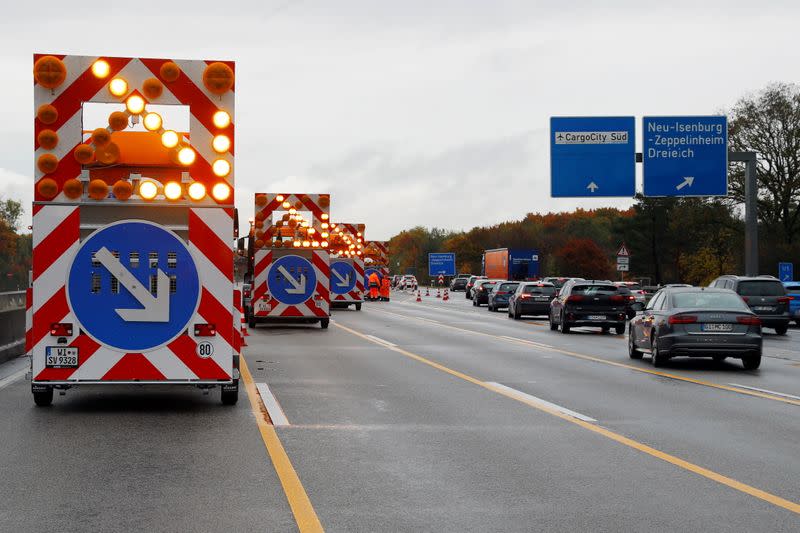 Activists hang on a bridge of A5 highway near Frankfurt causing traffic jams