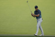 Jordan Spieth reacts to a missed birdie putt on the 15th green during the final round of the Masters golf tournament on Sunday, April 11, 2021, in Augusta, Ga. (AP Photo/Charlie Riedel)