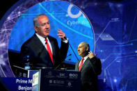 Israeli Prime Minister Benjamin Netanyahu gestures as he speaks during the Cyber Week conference at Tel Aviv University, Israel June 20, 2018. REUTERS/Ammar Awad