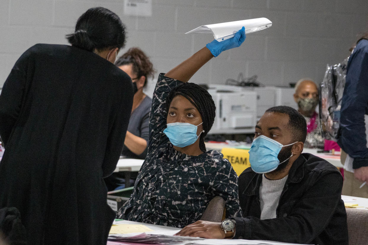 Gwinnett County election workers are seen during the by-hand recount of the Georgia 2020 presidential election (Getty Images)