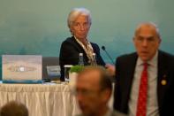 Christine Lagarde, the head of the International Monetary Fund, (C) prepares to leave after a panel of the High-level Tax Symposium held in Chengdu in Southwestern China's Sichuan province, Saturday, July 23, 2016. REUTERS/Ng Han Guan/Pool