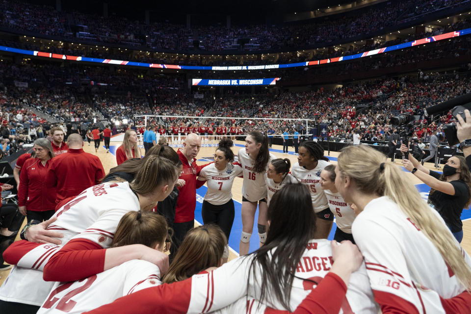 Wisconsin players huddle prior to the championship match of the NCAA women's college volleyball tournament against Nebraska Saturday, Dec. 18, 2021, in Columbus, Ohio. (AP Photo/Jeff Dean)