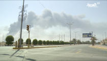 In this image made from a video broadcast on the Saudi-owned Al-Arabiya satellite news channel on Saturday, Sept. 14, 2019, smoke from a fire at the Abqaiq oil processing facility can be seen in Buqyaq, Saudi Arabia. Drones launched by Yemen's Houthi rebels attacked the world's largest oil processing facility in Saudi Arabia and another major oilfield Saturday, sparking huge fires at a vulnerable chokepoint for global energy supplies. (Al-Arabiya via AP) TV OUT NO SALES