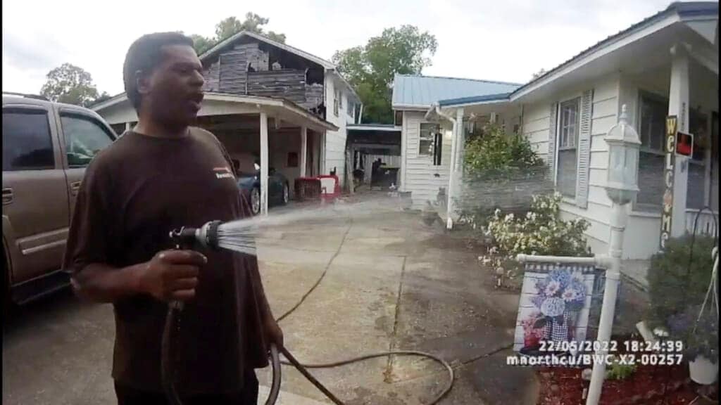 This image captured from bodycam video released by the Childersburg (Ala.) Police Department and provided by attorney Harry Daniels shows Michael Jennings, left, in custody in Childersburg, Ala., on Sunday, May 22, 2022. (Childersburg Police Department via AP)