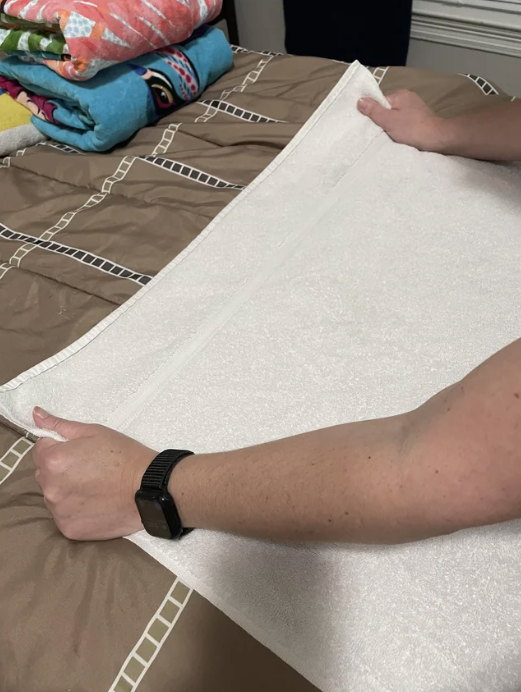 a person stretching a towel