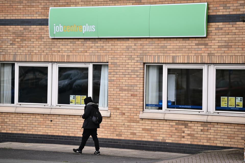 BLACKBURN-ENGLAND - APRIL 29: A man walks past a Jobcentre Plus employment office on April 29, 2021 in Blackburn, England. (Photo by Nathan Stirk/Getty Images)